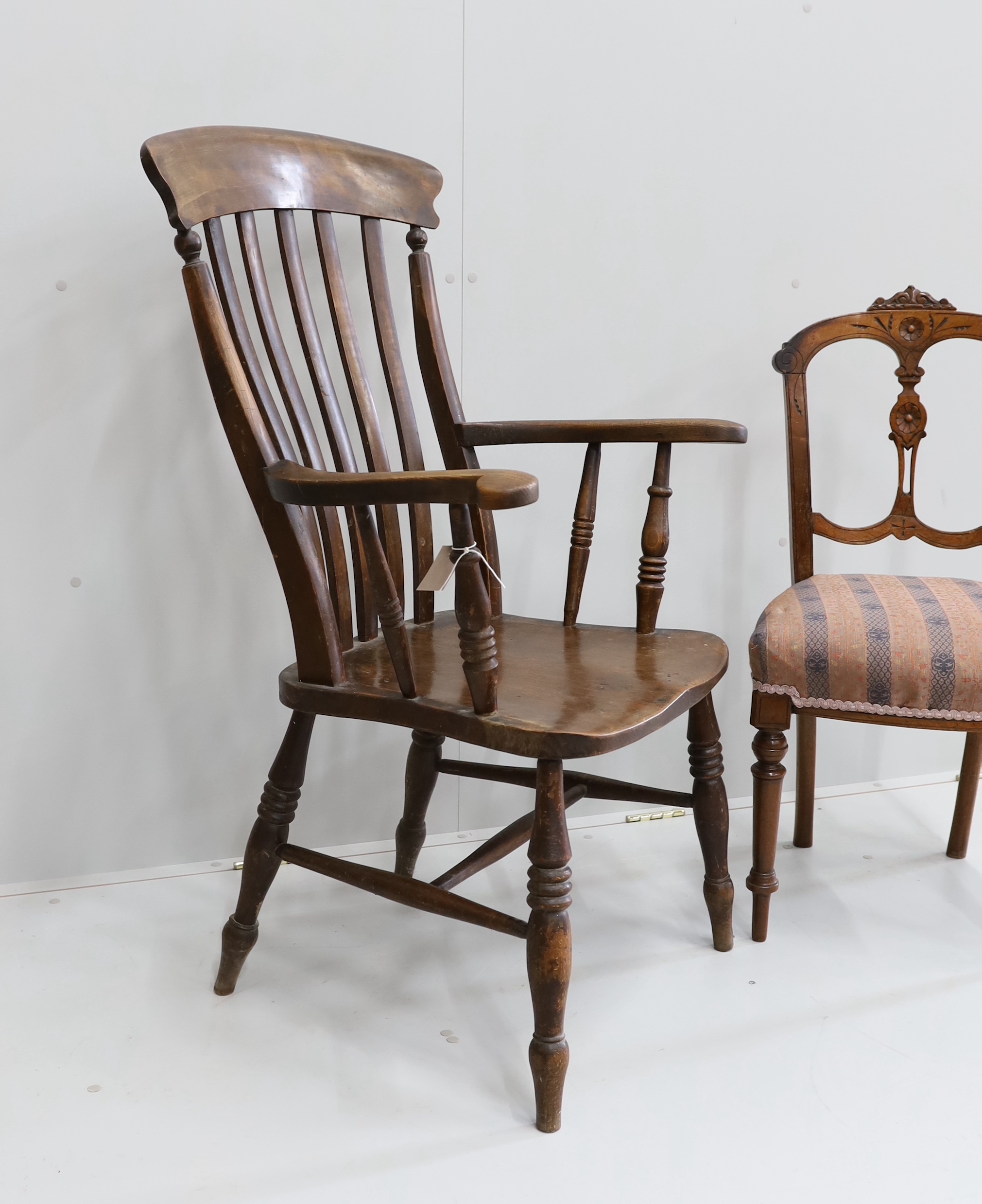 A Victorian elm and beech Windsor lathe back armchair, width 65cm, height 111cm, together with a Victorian walnut dining chair